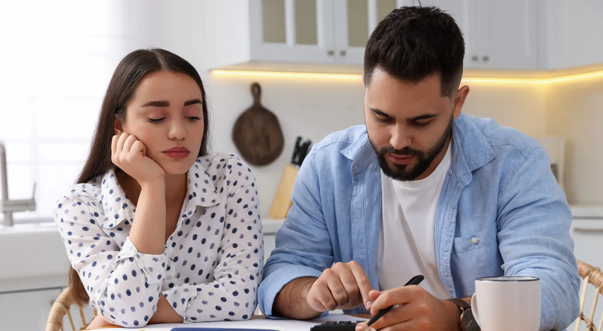 A couple working through their finances together at home