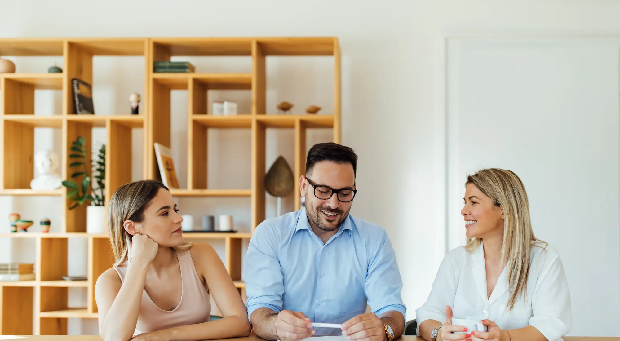 A couple meeting a mortgage adviser at a table