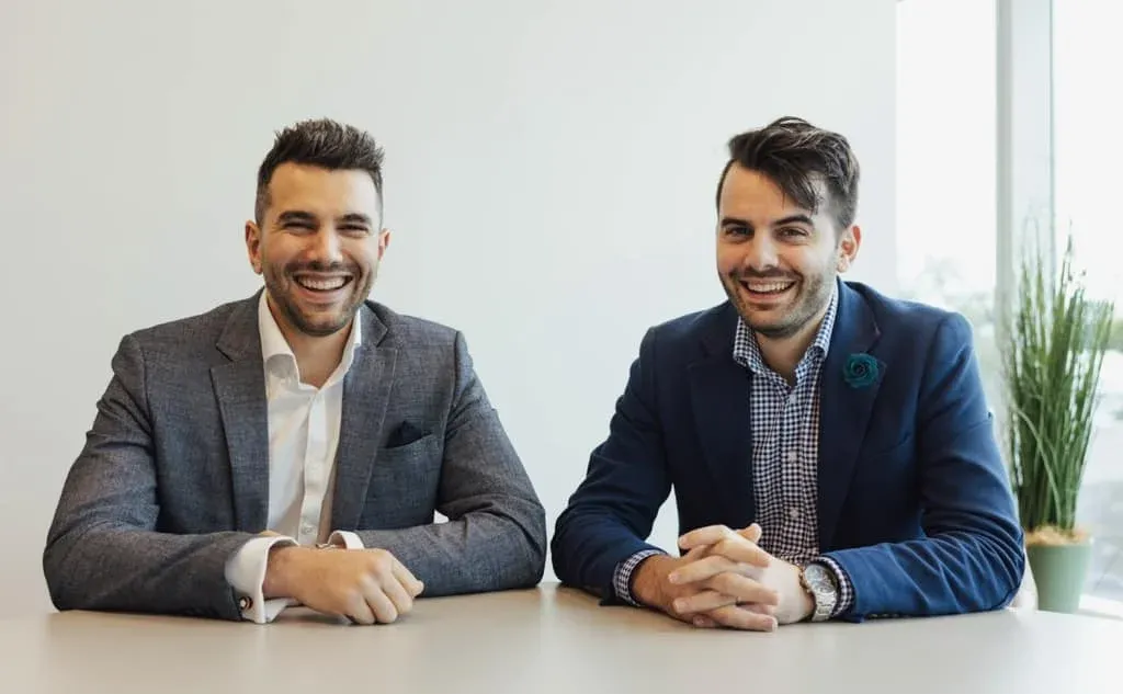 Hunter Galloway brokers at a client meeting table