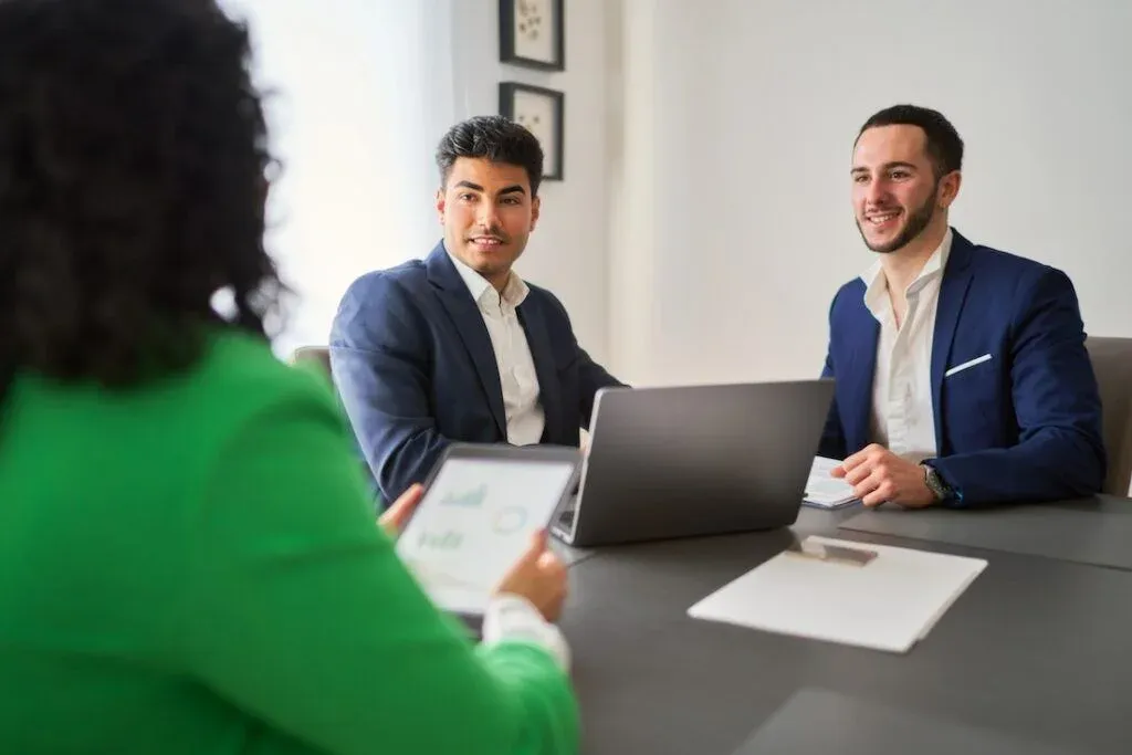 Hunter Galloway brokers discussing loan options with a client
