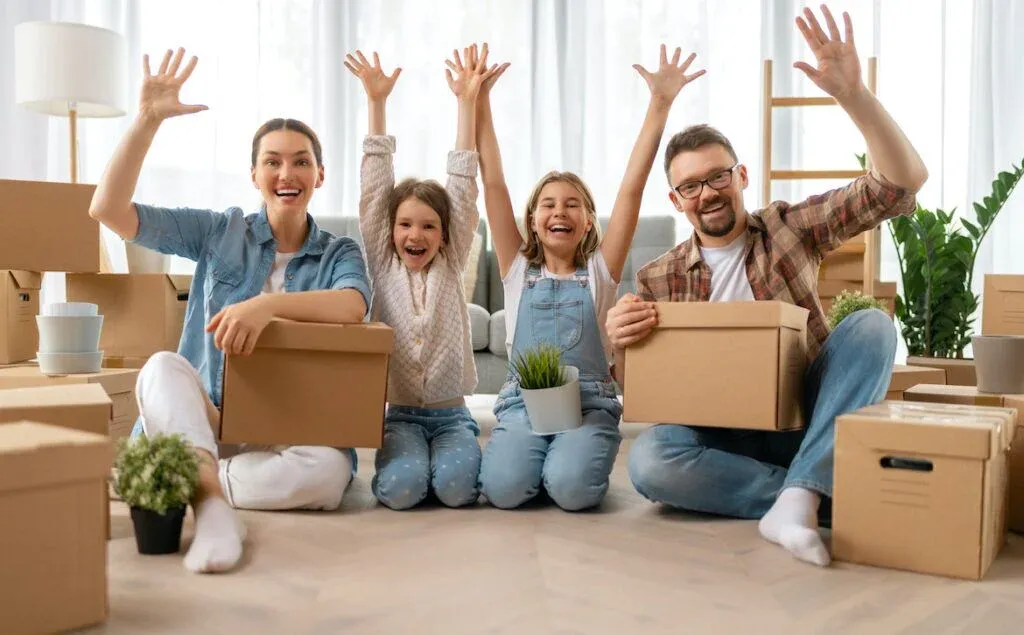 A family with moving boxes in a home