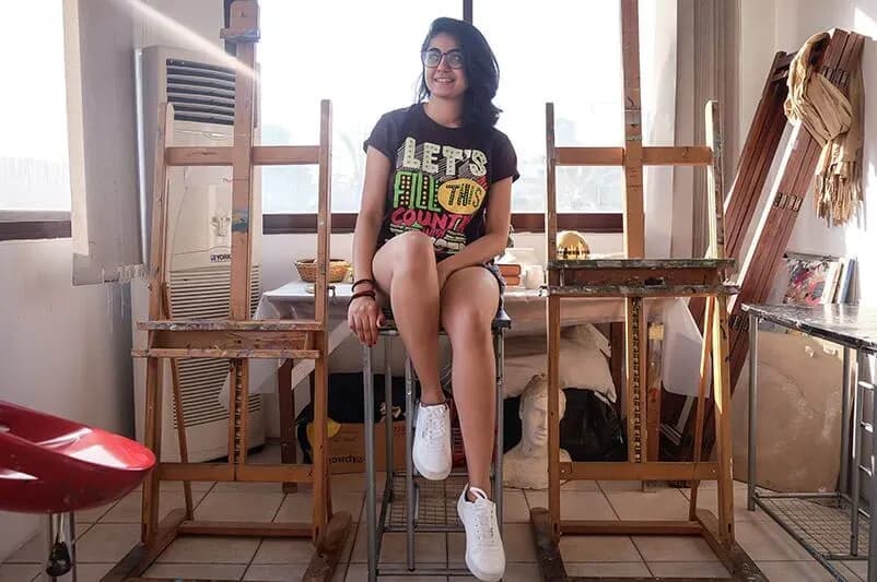 A woman sitting on a chair in a home