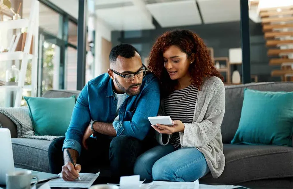 A couple reviewing their household budget