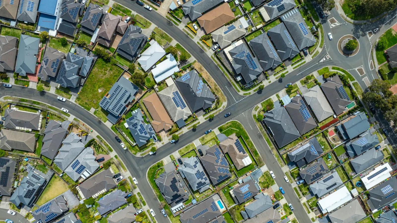 Overhead view of neighbouring houses and residential streets.