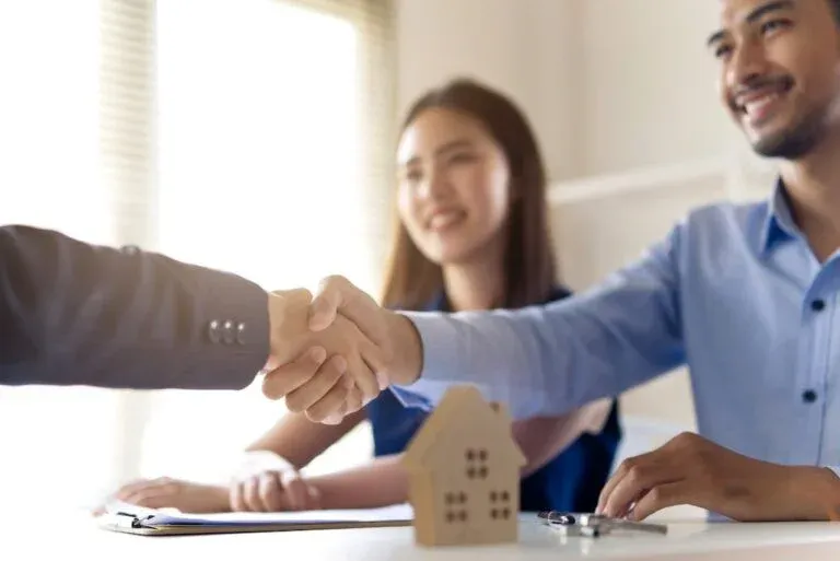 Borrowers discussing a loan with a broker