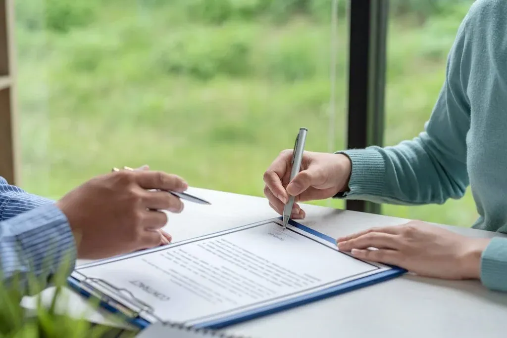 Buyer signing a property contract with another person