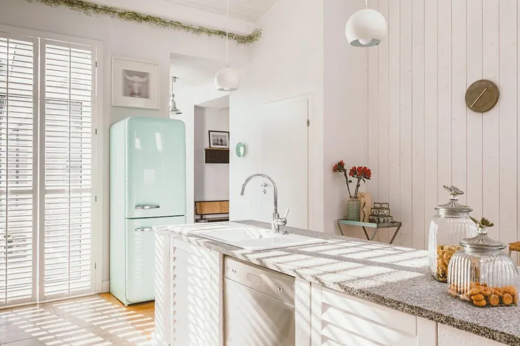 A kitchen with appliances and fitted cupboards