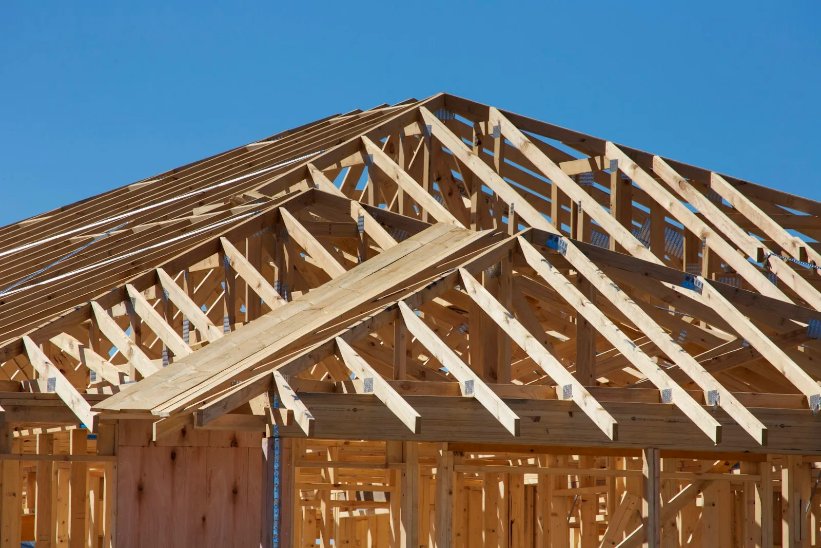 Timber frame and roof trusses of a new house under construction in Clyde North, Victoria