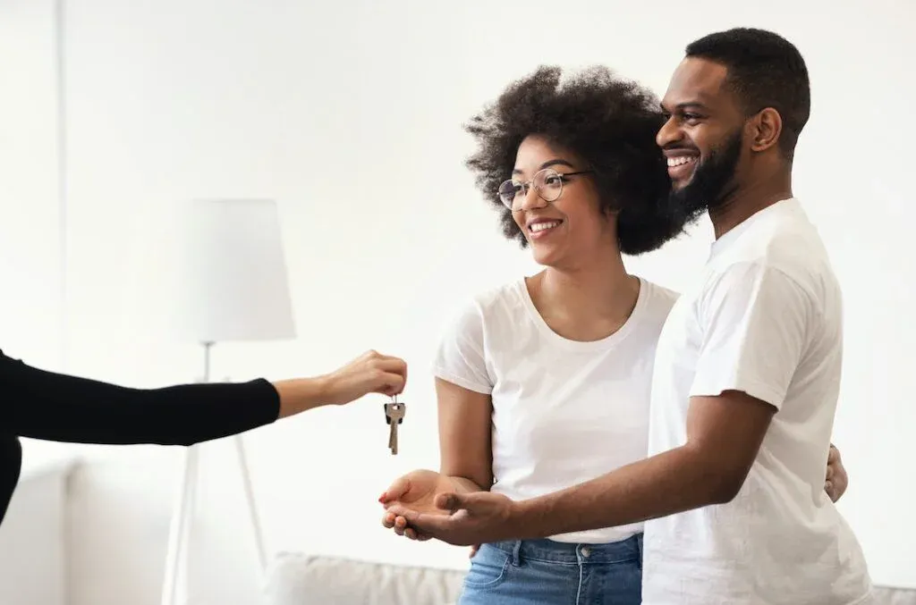 Renters receiving keys to a property