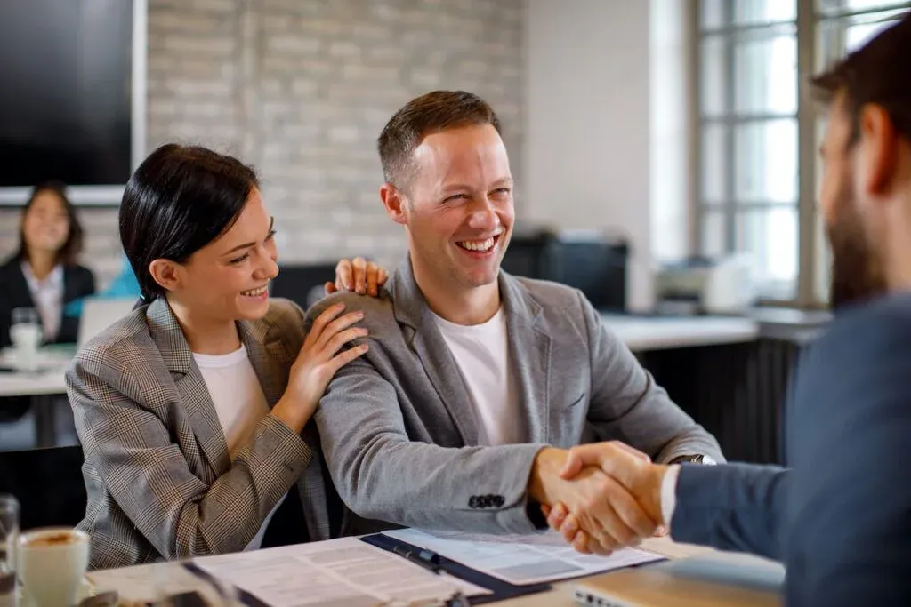 A couple discussing their home finance at a meeting