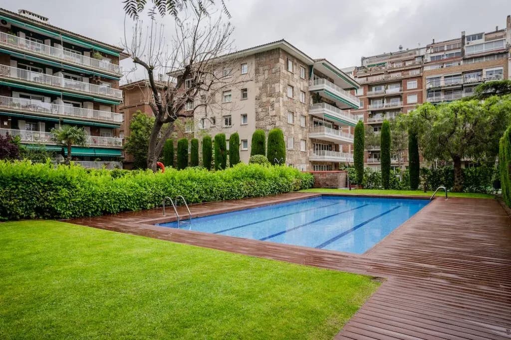 Swimming pool and gardens shared by an apartment complex