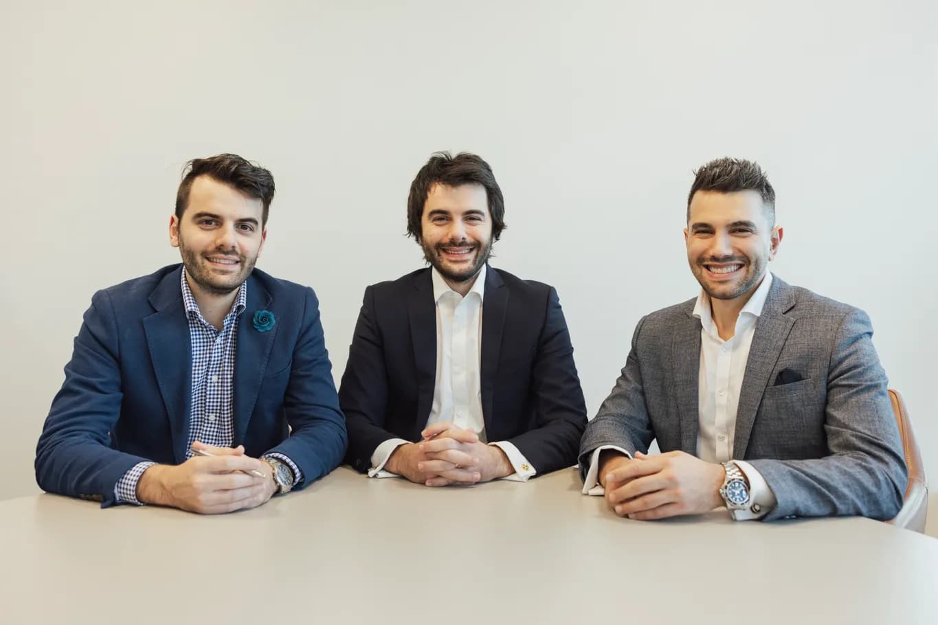 The Hunter Galloway broker team around the table in its Brisbane office
