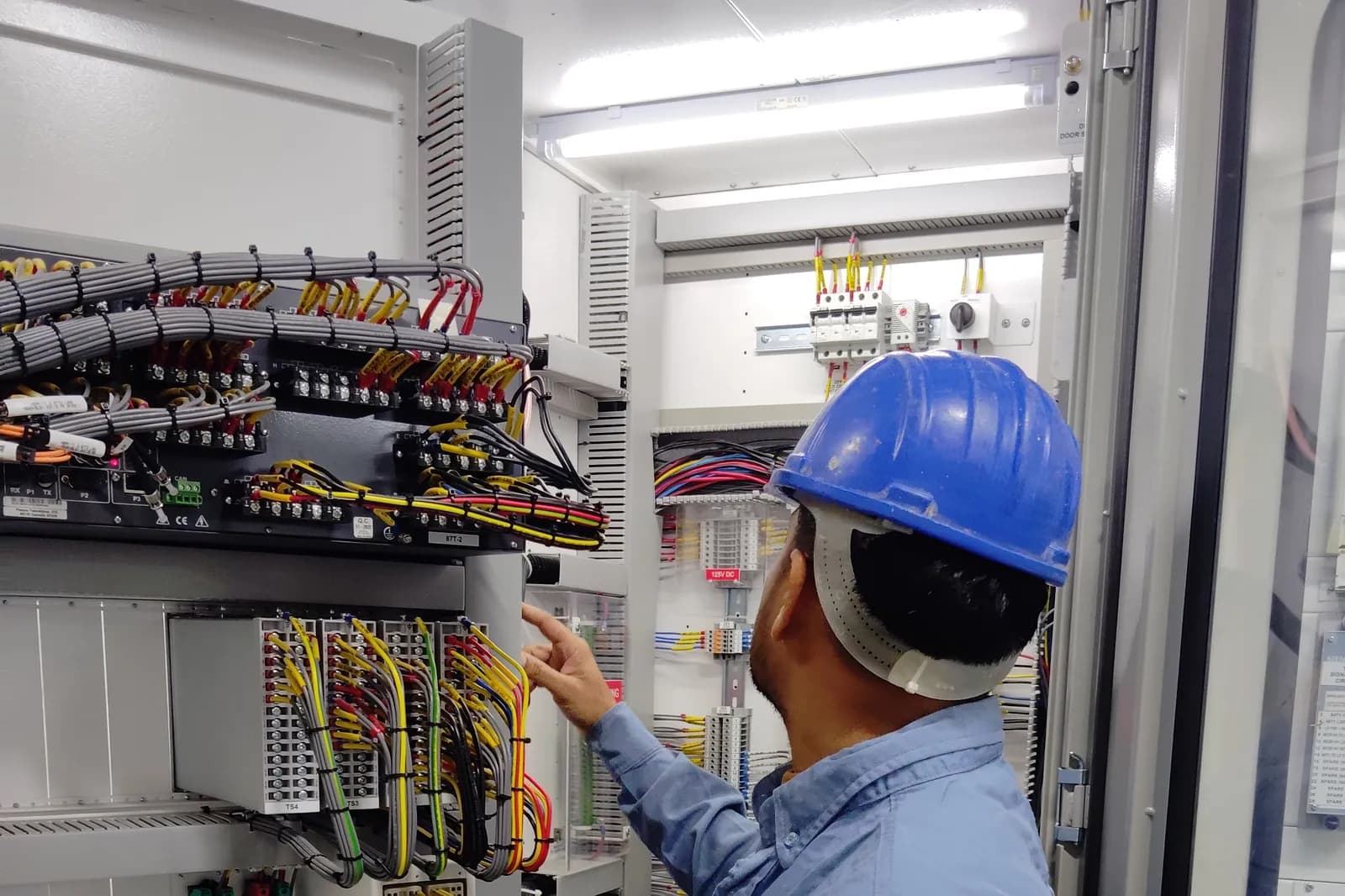 An electrician working on electrical wiring
