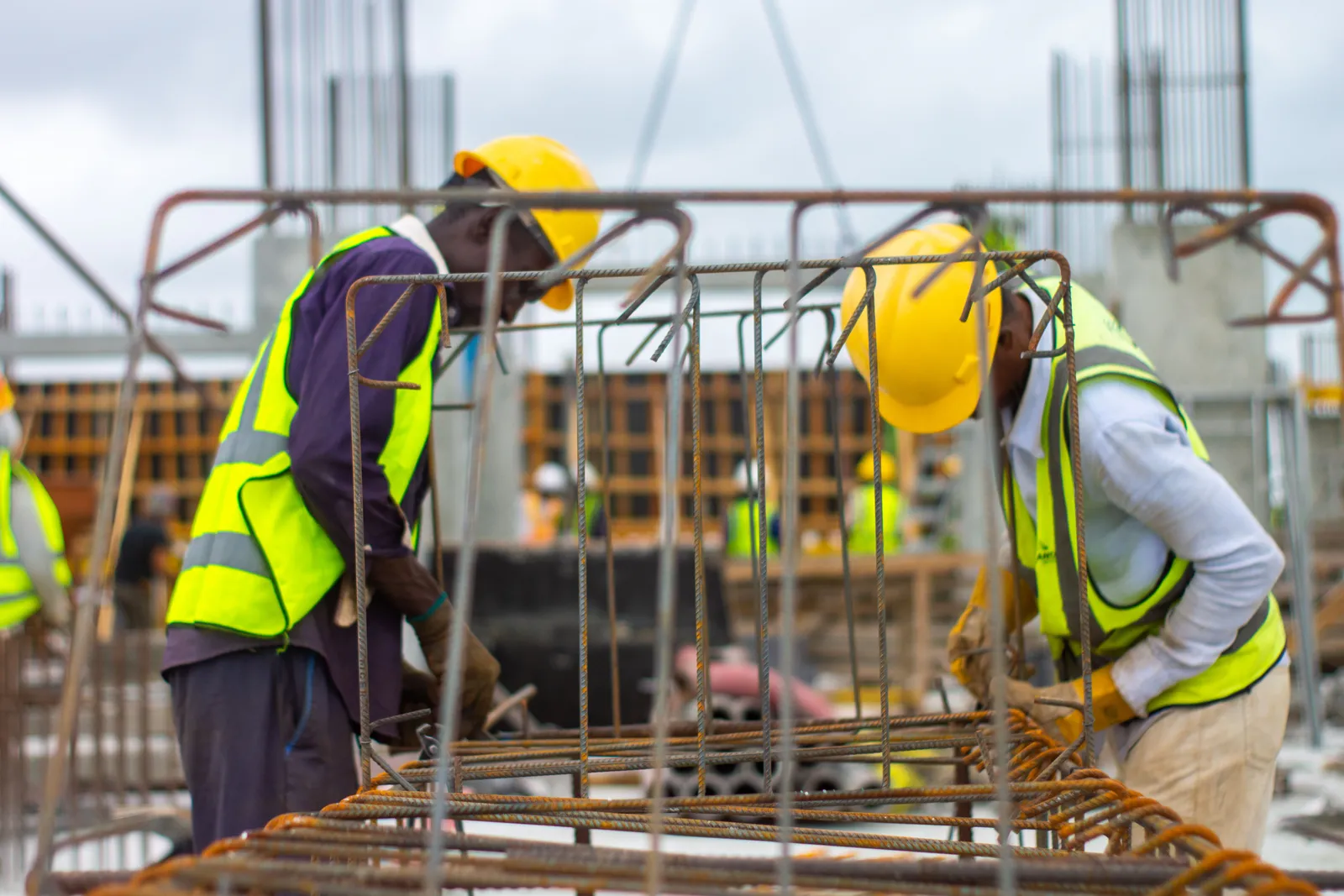 A tradie reviewing plans on a construction site