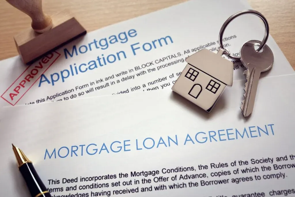 how to buy a house - signing loan documents