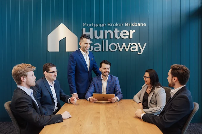 Hunter Galloway mortgage brokers reviewing home loan options together