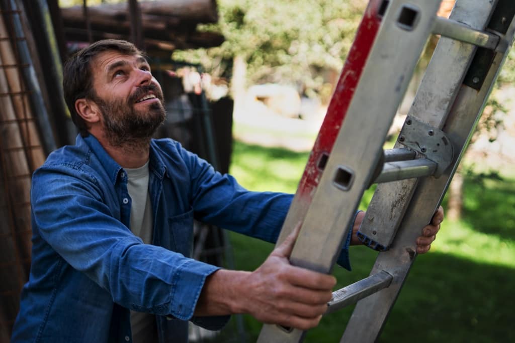 A person climbing the ladder of property ownership by buying a home with parents